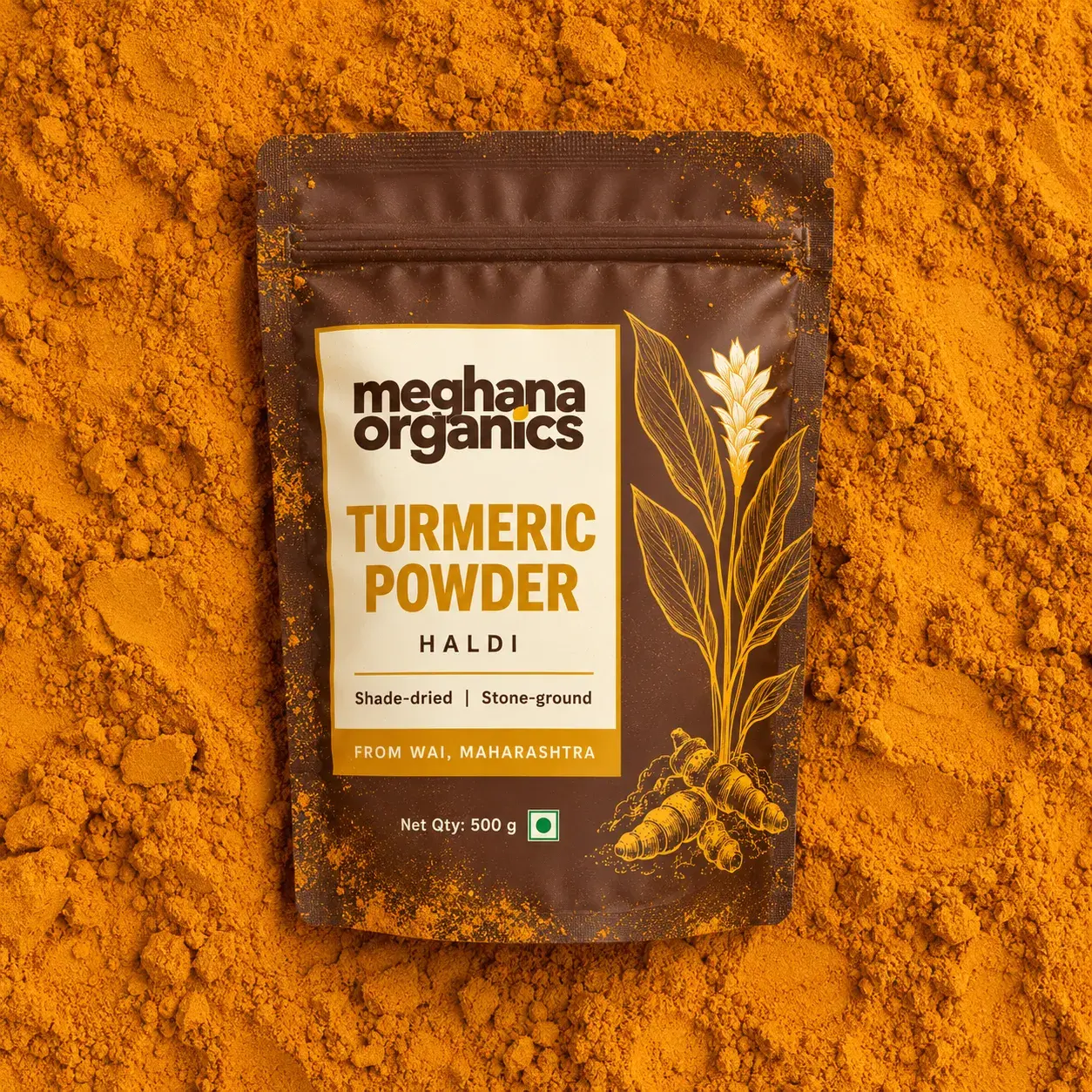 A pouch of Meghana Organics turmeric powder on a bed of haldi